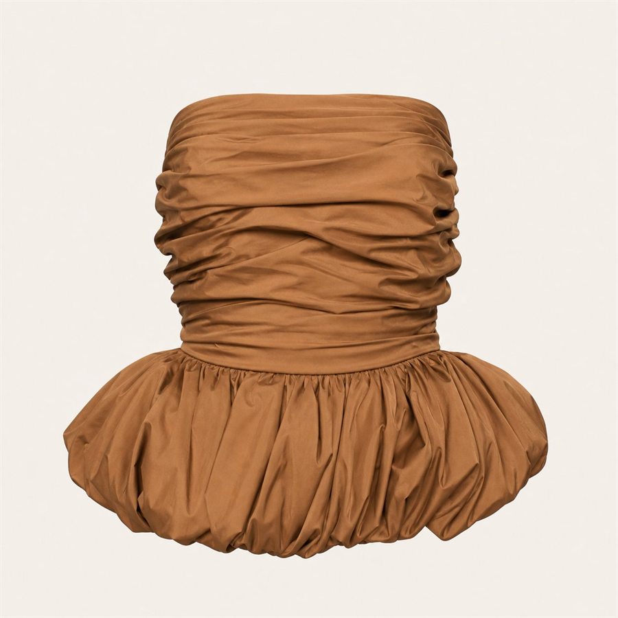 Caramel tan ruched strapless top on a warm off-white background